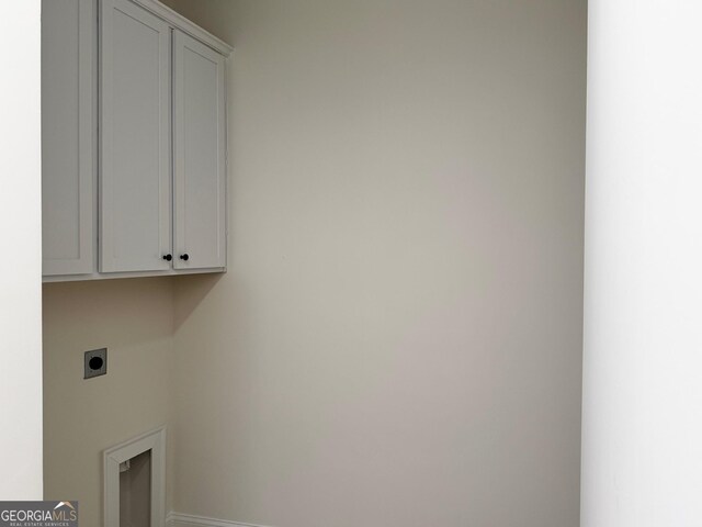 kitchen with white cabinets, hanging light fixtures, stainless steel appliances, and sink