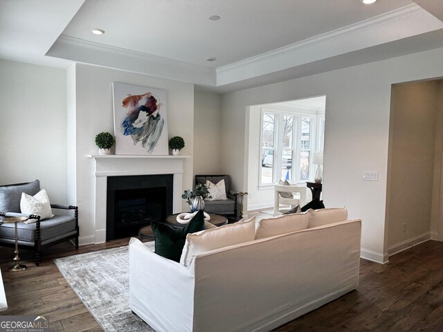 carpeted bedroom featuring crown molding, a raised ceiling, and a chandelier