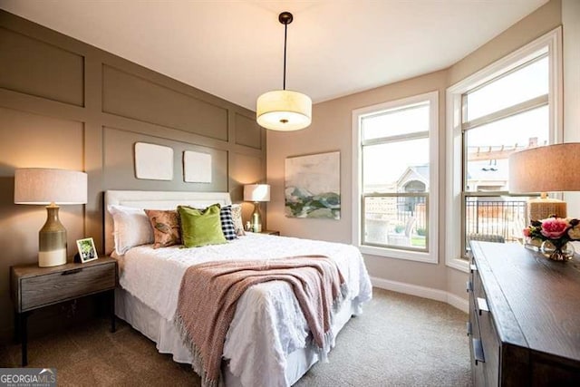 bedroom with dark colored carpet