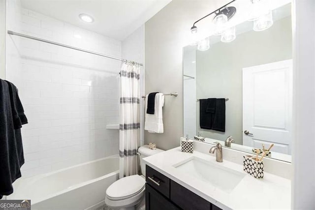 full bathroom with vanity, toilet, and shower / tub combo