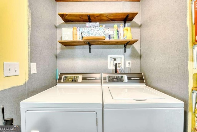 laundry area with washing machine and dryer