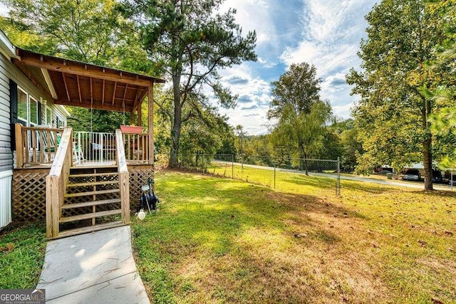 view of yard featuring a wooden deck