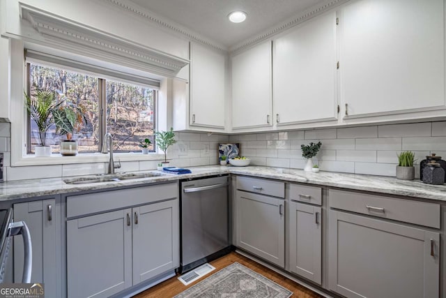 200 Villa Rd Unit 126, Jasper, GA 30143 - kitchen with stainless steel dishwasher, gray cabinetry, range, backsplash, and wood finished floors