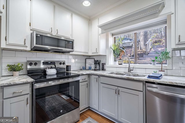 200 Villa Rd Unit 126, Jasper, GA 30143 - kitchen featuring appliances with stainless steel finishes, backsplash, white cabinetry, light stone countertops, and recessed lighting