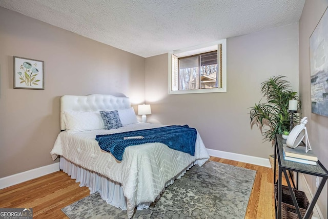200 Villa Rd Unit 126, Jasper, GA 30143 - bedroom with wood finished floors and a textured ceiling