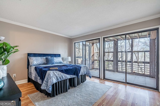 200 Villa Rd Unit 126, Jasper, GA 30143 - bedroom with access to exterior, wood finished floors, a textured ceiling, and ornamental molding