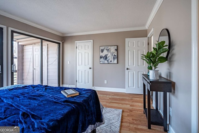 200 Villa Rd Unit 126, Jasper, GA 30143 - bedroom with a textured ceiling, light wood-type flooring, and ornamental molding