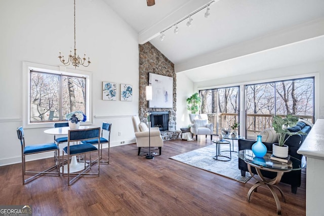 200 Villa Rd Unit 126, Jasper, GA 30143 - living area featuring rail lighting, a stone fireplace, high vaulted ceiling, wood finished floors, and a chandelier