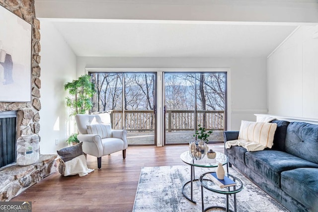 200 Villa Rd Unit 126, Jasper, GA 30143 - living room with wood finished floors and a stone fireplace
