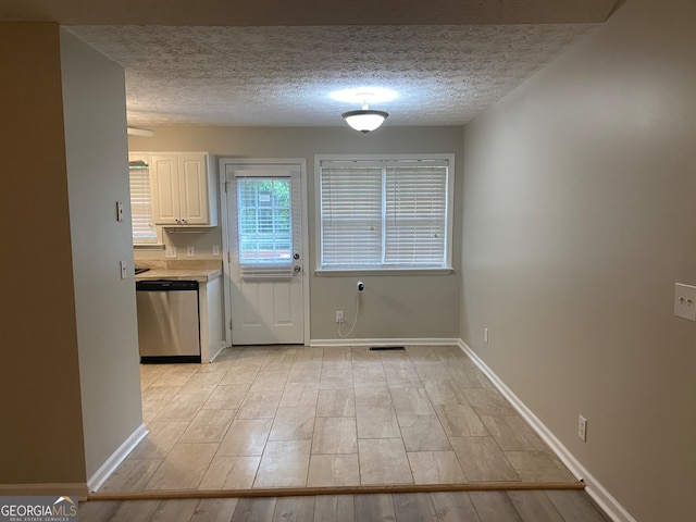 interior space featuring a textured ceiling