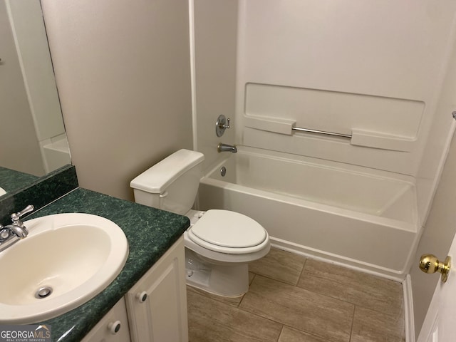 full bathroom with vanity, toilet, and washtub / shower combination