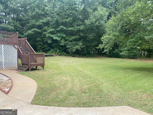 view of yard with a deck