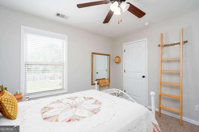 carpeted bedroom with ceiling fan