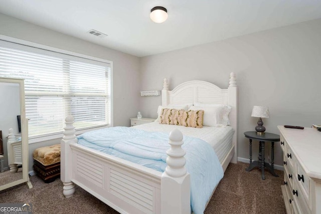 carpeted bedroom featuring multiple windows