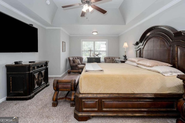 carpeted bedroom featuring ornamental molding, a raised ceiling, and ceiling fan