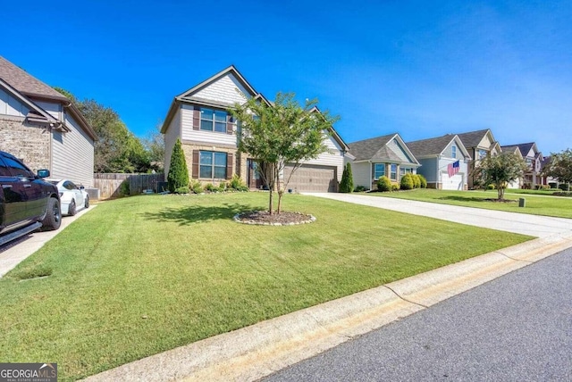 view of front of house featuring a front yard and a garage