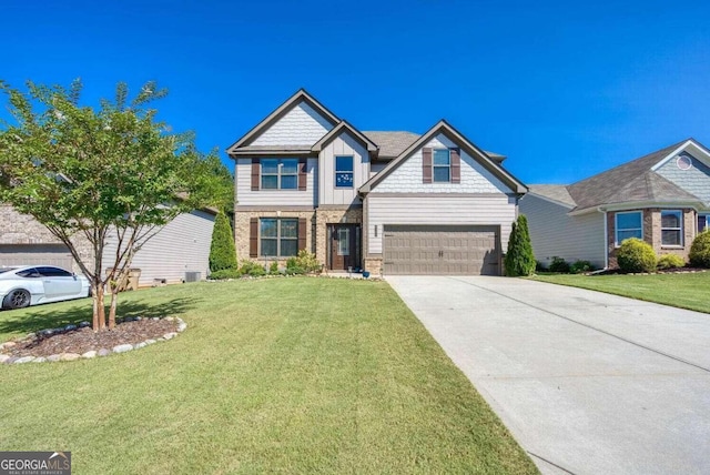 view of front of property featuring a garage and a front yard