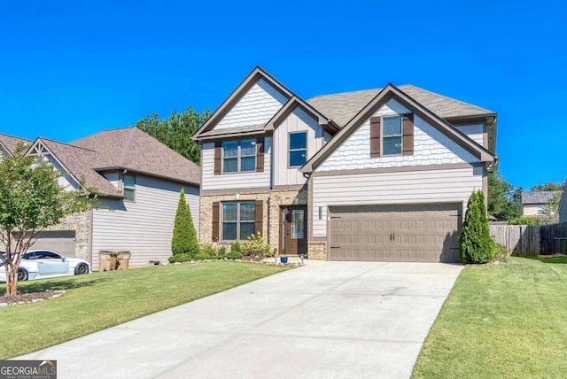 craftsman inspired home with a garage and a front lawn