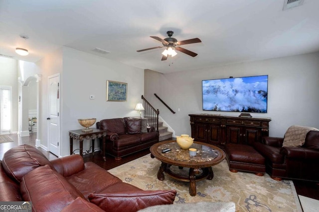 living room with hardwood / wood-style floors and ceiling fan