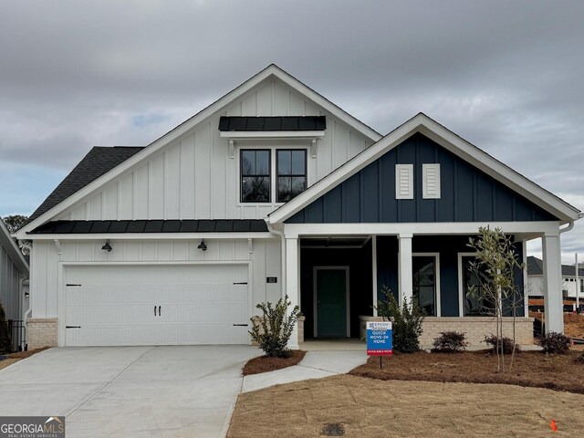 view of front facade with a lawn and a garage