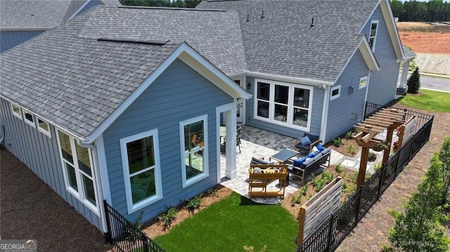 back of property featuring an outdoor hangout area and a patio area