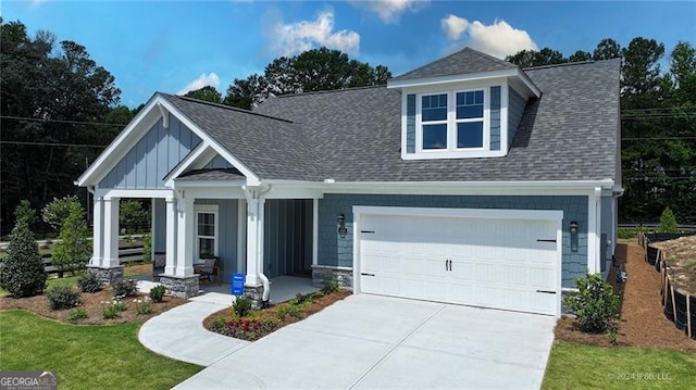 view of front facade featuring a garage and a porch