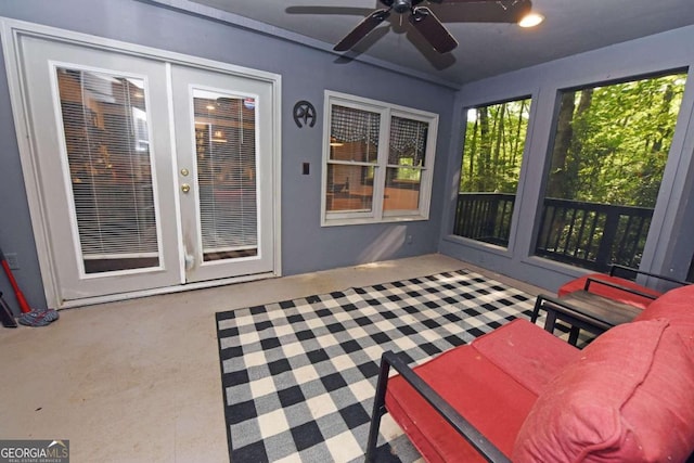 sunroom / solarium featuring ceiling fan