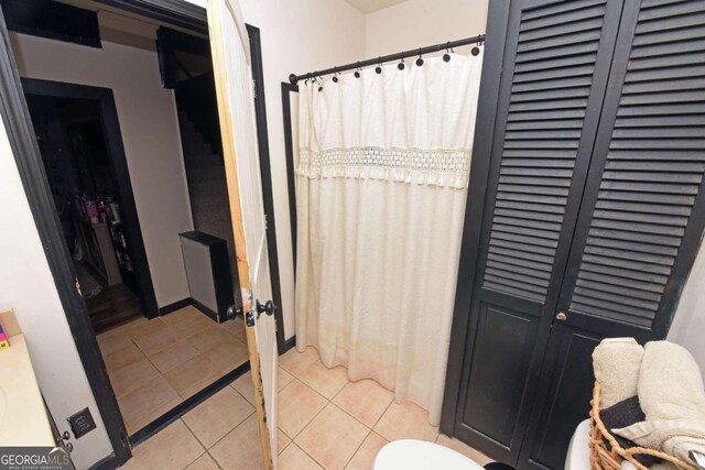 bathroom with tile patterned flooring