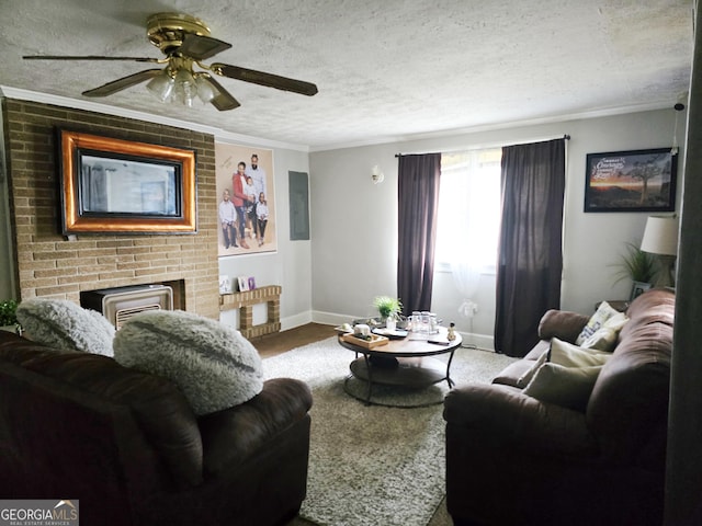 carpeted living area featuring ceiling fan, a textured ceiling, crown molding, and baseboards