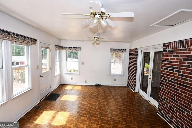 interior space featuring ceiling fan and french doors