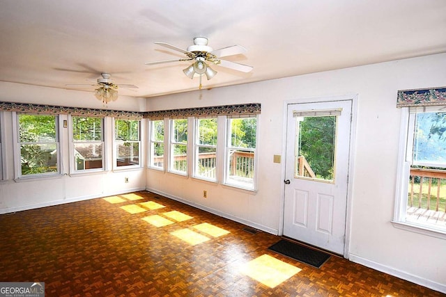 interior space with ceiling fan and a healthy amount of sunlight