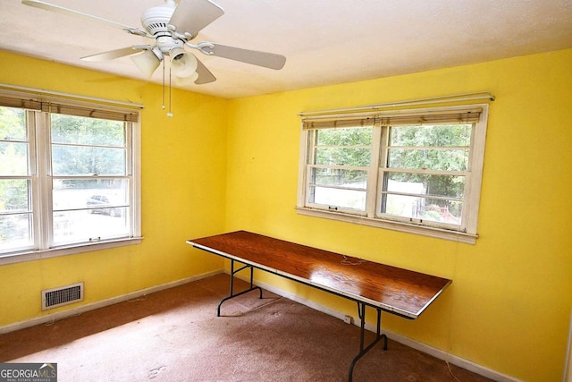 home office featuring carpet flooring and ceiling fan