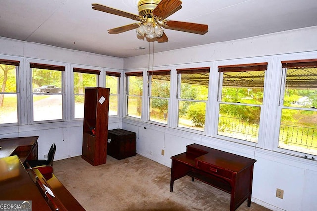 sunroom / solarium with ceiling fan