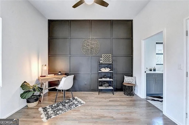 office featuring light hardwood / wood-style floors and ceiling fan