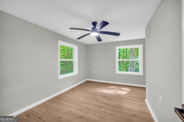 unfurnished room with ceiling fan and light hardwood / wood-style flooring