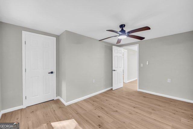 spare room featuring ceiling fan and light wood-type flooring