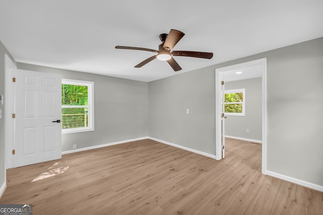 unfurnished room with ceiling fan and light hardwood / wood-style floors