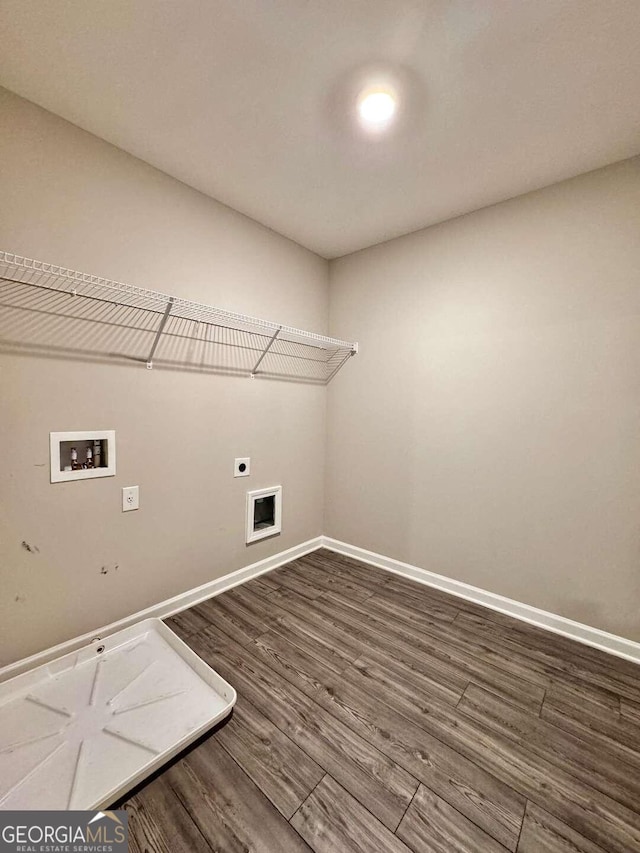 washroom featuring washer hookup, electric dryer hookup, and dark hardwood / wood-style floors