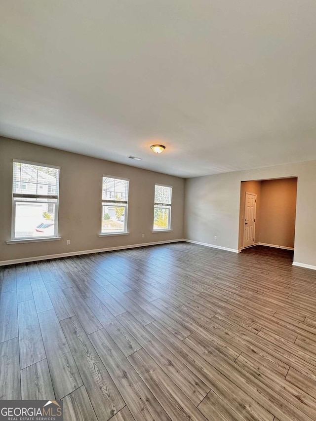 spare room with light hardwood / wood-style floors