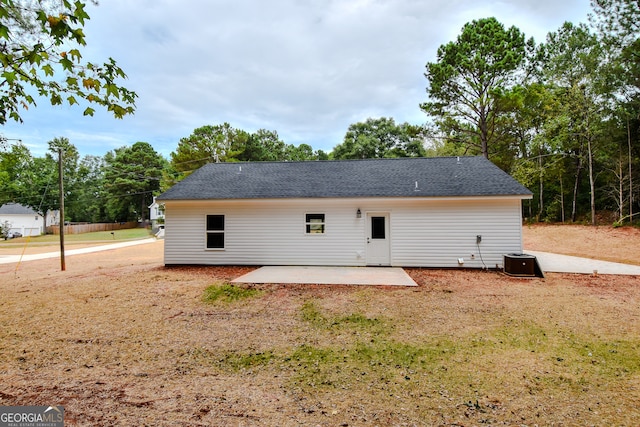 back of property featuring central AC unit and a patio