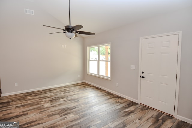 spare room featuring hardwood / wood-style floors and ceiling fan