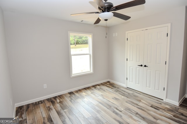 unfurnished room featuring ceiling fan and light hardwood / wood-style floors