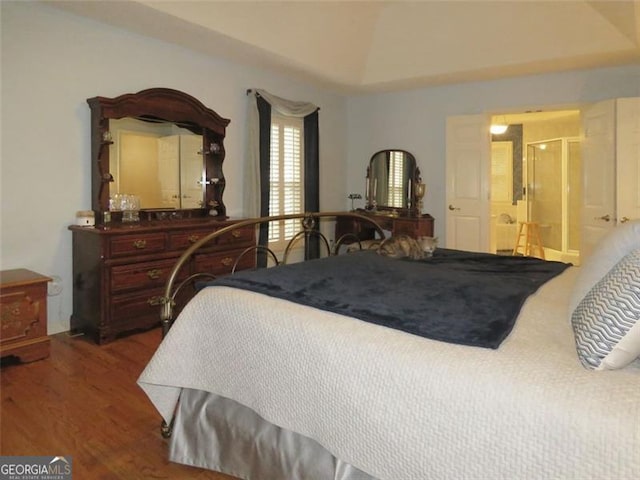 bedroom with hardwood / wood-style floors