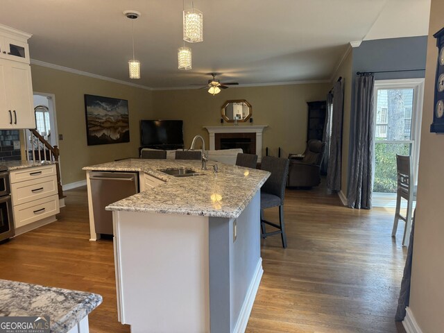 kitchen with white cabinetry, stainless steel appliances, and light wood-type flooring