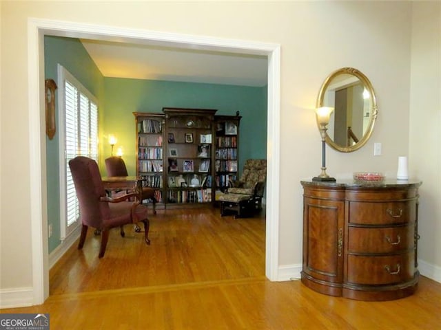 living area with hardwood / wood-style floors