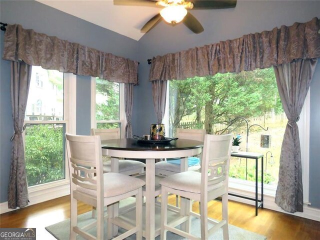 kitchen featuring appliances with stainless steel finishes, light hardwood / wood-style flooring, white cabinets, and backsplash