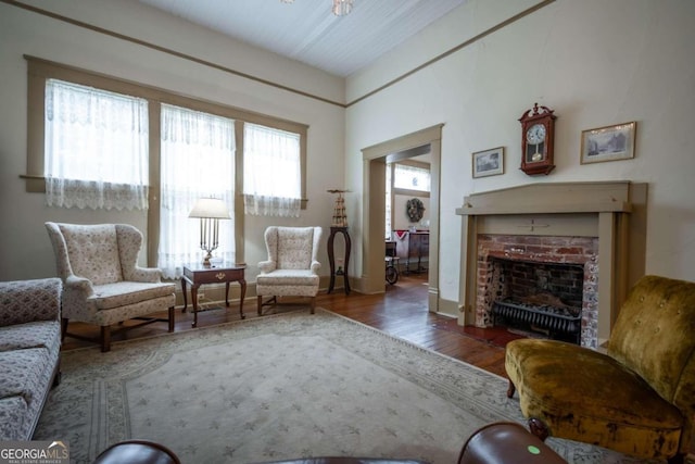 sitting room featuring dark hardwood / wood-style flooring