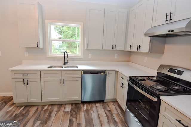 kitchen with dark wood-type flooring, dishwasher, black / electric stove, and sink