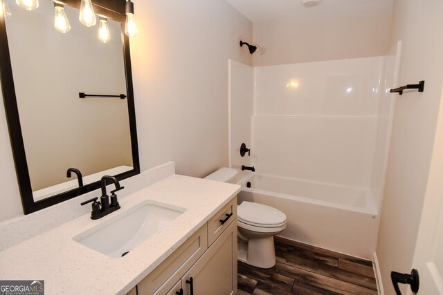101 Alexandria Way, Thomaston, GA 30286 - bathroom featuring wood finished floors, toilet, vanity, and  shower combination