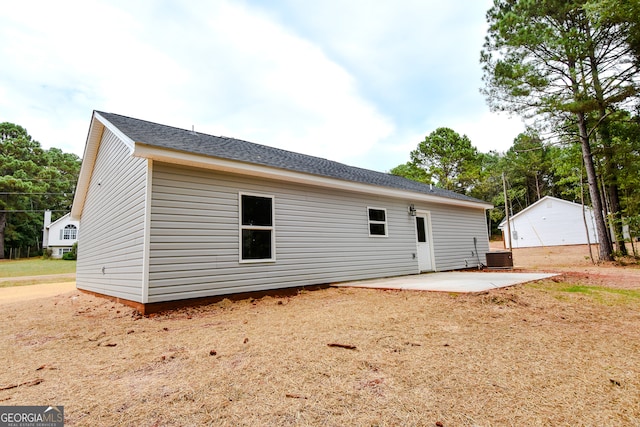 back of property featuring cooling unit and a patio area